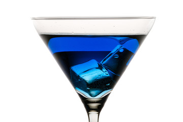 Martini glass with ice and blue liqueur