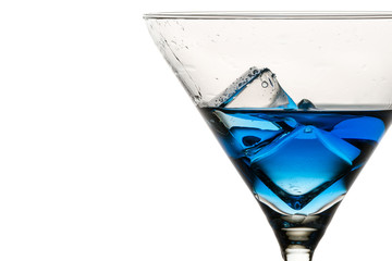 Closeup ice cubes with drops in martini glass