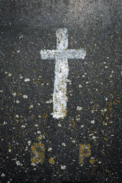 Cross on stone
