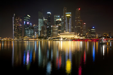 Fototapeta na wymiar Night lights and skyscrapers' reflection at Singapore
