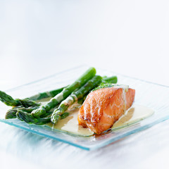 Salmon fillet with asparagus and yellow sauce