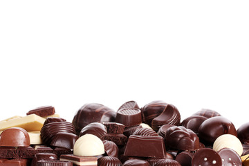 Many different chocolate candy isolated on white