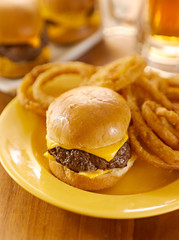 plate with burger slider and onion rings