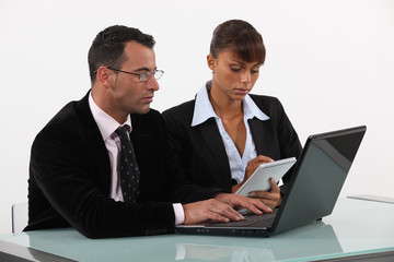 businessman and businesswoman working together