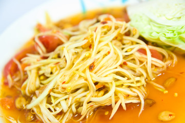 Somtum Thai food and spicy food on a white dish