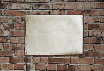 Fototapeta na wymiar paper on brickwall