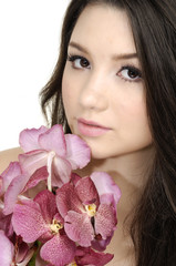 Young girl holding bouquet orchid flower in her hands