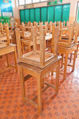 Wooden tables in classroom