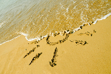 Drawing of sun in the sand on exotic beach