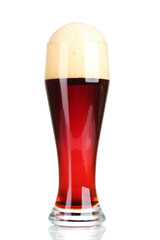 red beer with foam in glass isolated on white