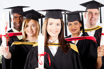 group of graduates in graduation gown and cap