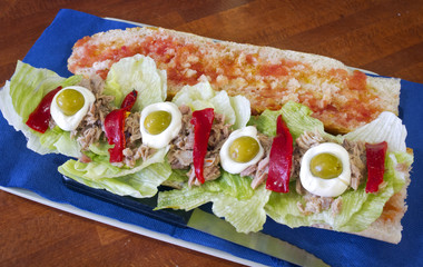 Healthy sandwich  with fresh red pepper, tomato, olives, tuna