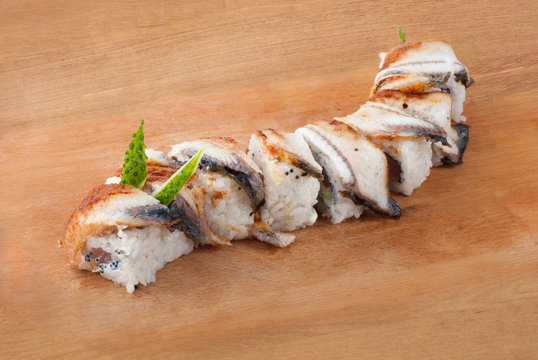 Japanese sushi with eel on wooden plate