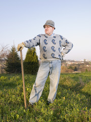 Farmer posing with his line of tillage