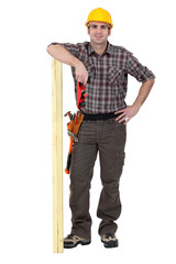 Carpenter with planks of wood