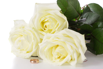White roses and wedding ring