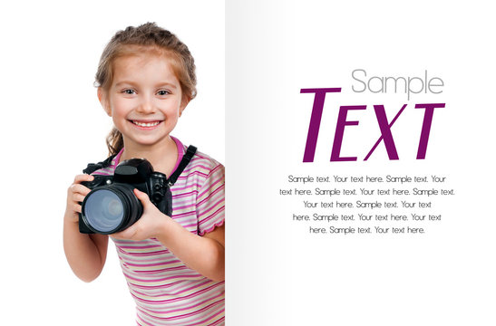 girl with a camera looking for a white blank