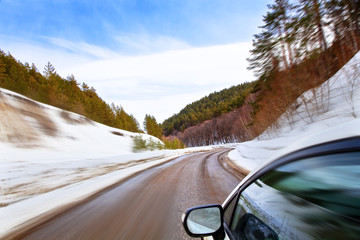 car moves along the winding roads of winter.
