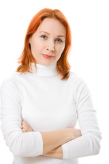Fototapeta premium A beautiful girl with red hair crossed her arms