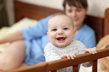 Happy baby in cot