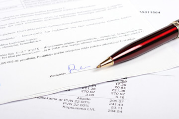 pen and business contract with signature