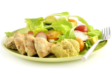 Salad with hummus and pita bread