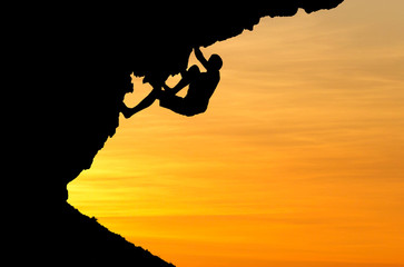 silhouette of climber in sunset