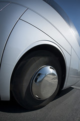 Big wheel and tire close up on a white bus © rubenkh