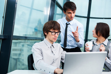 Сonfident business man explaining a project to colleagues