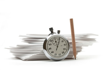 Pile of paper cards with pencil and stopwatch