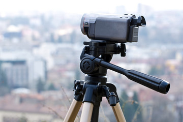 Camcorder against city panorama
