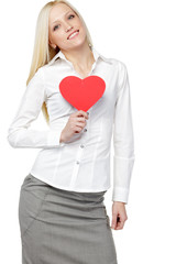 Young business woman holding heart shape