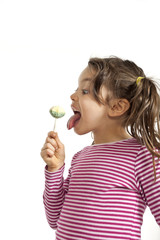 portrait of little girl with a lollipop