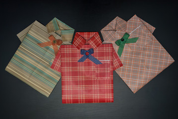 Gift wrap in the form of a shirt.