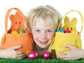 Cute blonde child is happy to found her Easter baskets