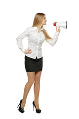 Full length of young business woman with megaphone