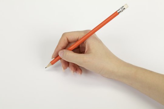 Hand with a pencil