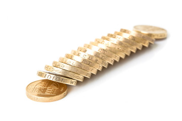 One pound coins laid in the domino effect