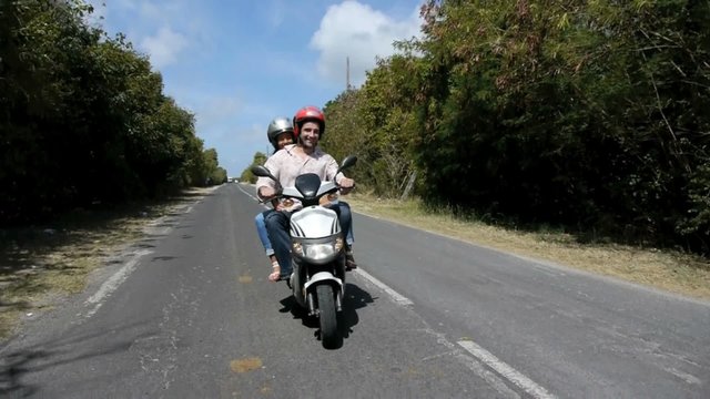 Young people having fun on a motorbike