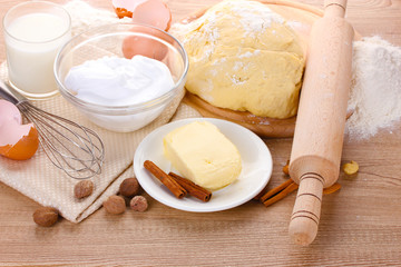 Fototapeta na wymiar Ingredients for the dough wooden table