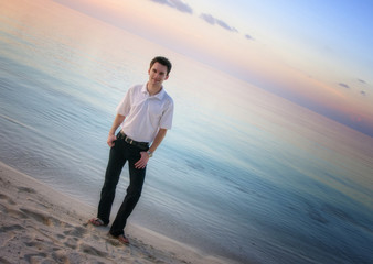 Attractive man on a beach with sunset / sunrise (Maldives)