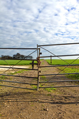 Fototapeta na wymiar gate to a country field