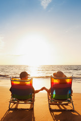 Happy Romantic Couple Enjoying Beautiful Sunset at the Beach