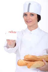 female bakery worker with business card