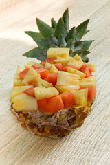 Fresh cut pineapple served in a natural bowl