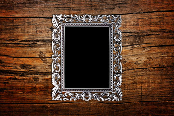 silver frame on a wood background