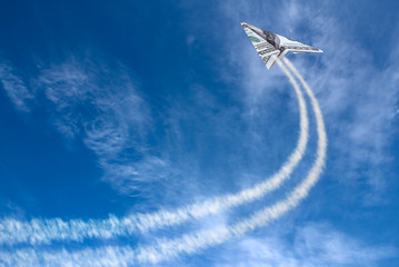 Hundred dollars plane on cloudy sky and trace .