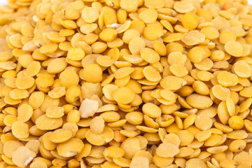 Yellow lentils isolated on white background.Macro shot