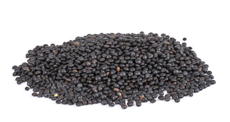 Heap of black lentil isolated on white