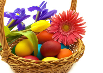 Colorful painted easter eggs in brown basket